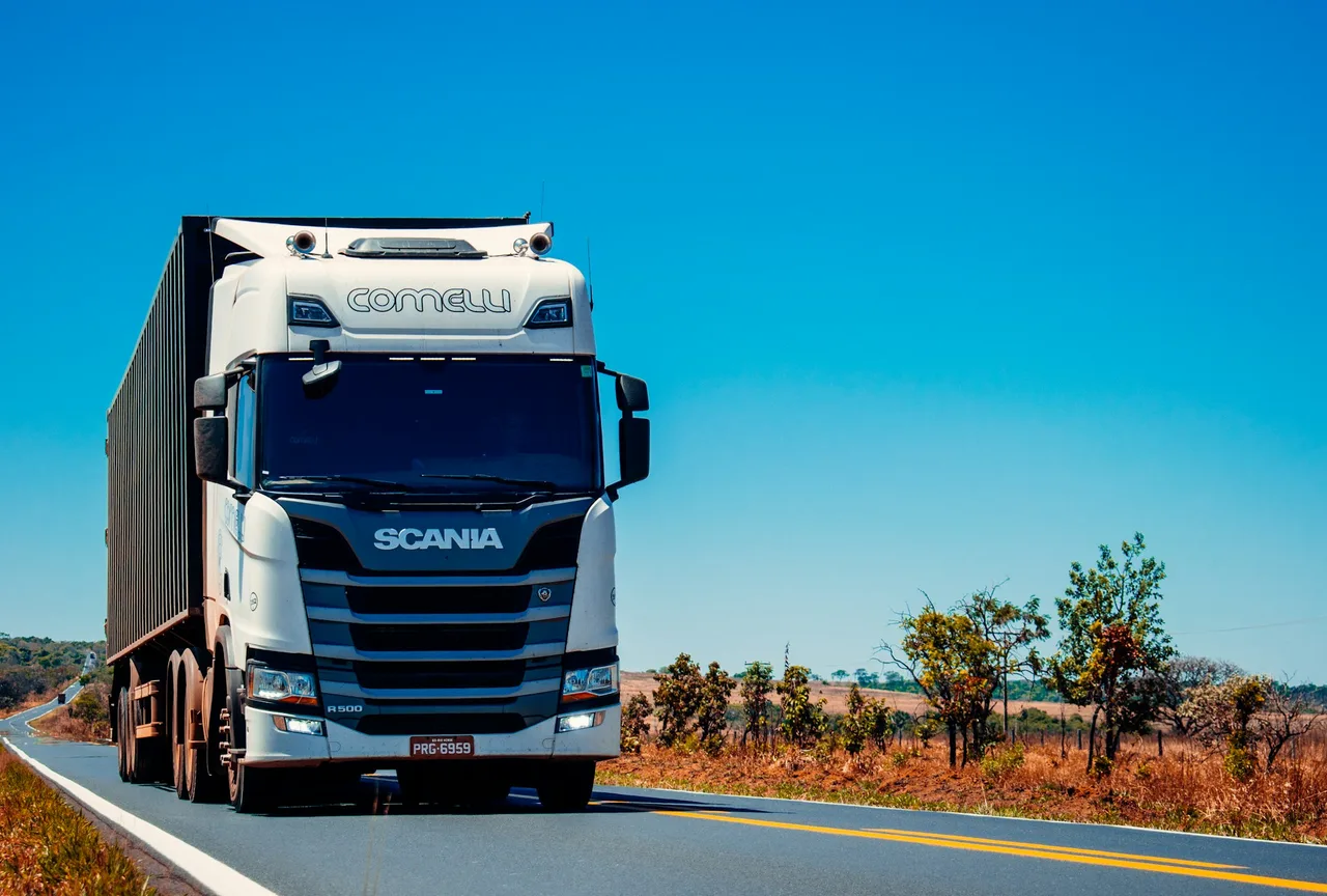 Commercial tractor-trailer hauling freight on an open highway